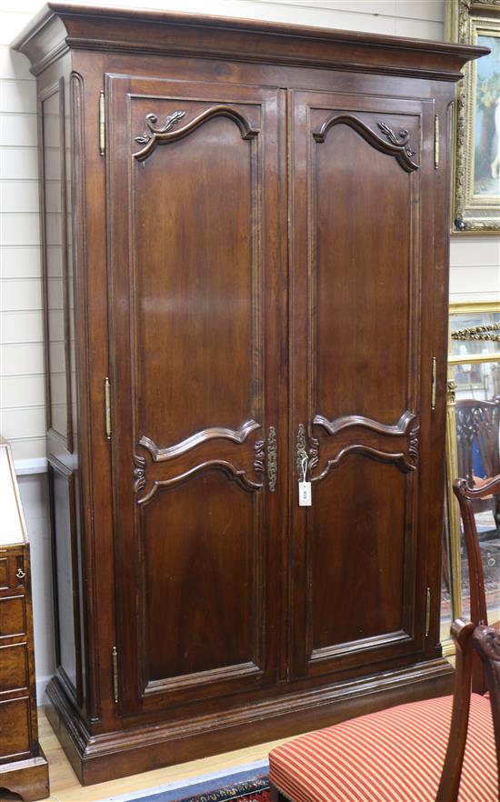 A Louis XV style walnut two door enclosed bookcase W.140cm